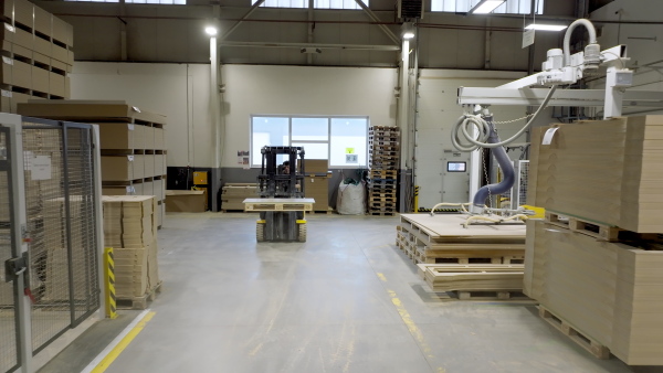 A forklift working in warehouse. Industrial lift truck, jitney lifting and moving materials in modern factory. Warehouse banner with copy space.