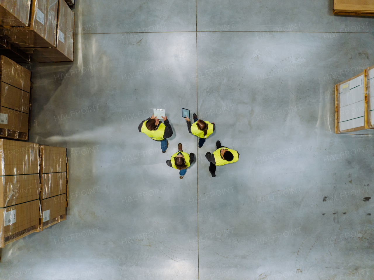 Top aerial view of workers modern warehouse storage of retail shop, large factory workshop space. Employees in modern industrial factory with warehouse.