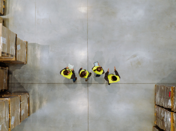 Top aerial view of workers modern warehouse storage of retail shop, large factory workshop space. Employees in modern industrial factory with warehouse.