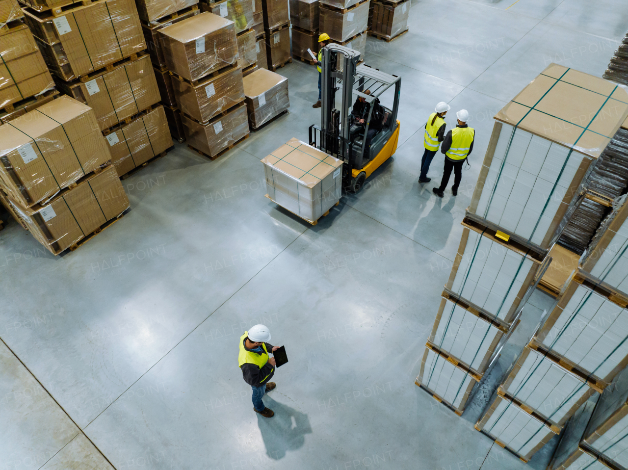 Top aerial view of workers modern warehouse storage of retail shop, large factory workshop space. Employees in modern industrial factory with warehouse.