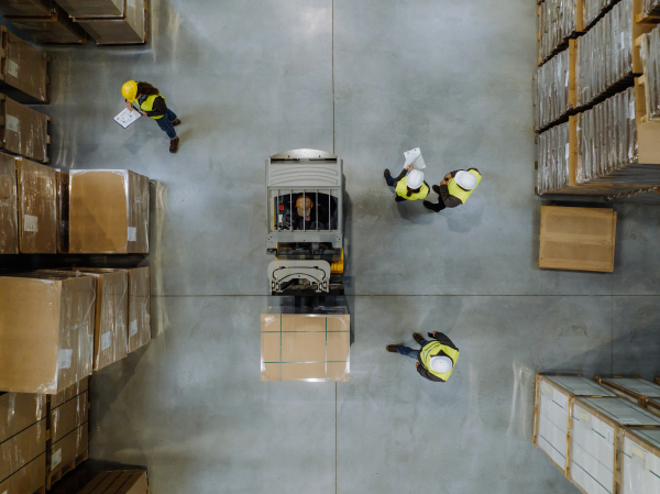 Interior of a modern warehouse storage of retail shop or large factory workshop space. Modern industrial factory with warehouse.