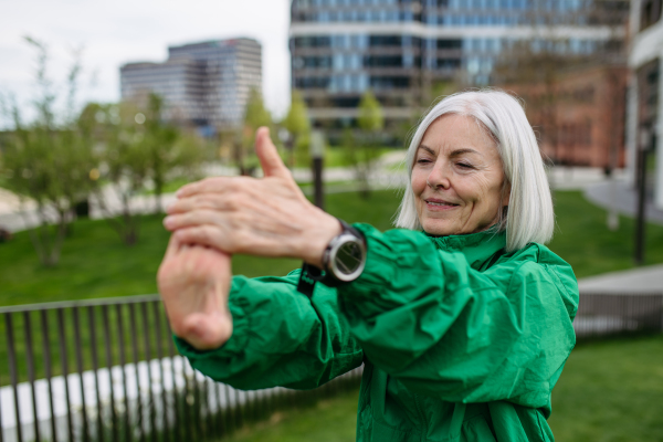 Mature woman stretching before run. Exercising after work for good mental health, physical health, and relieving stress and boost mood.