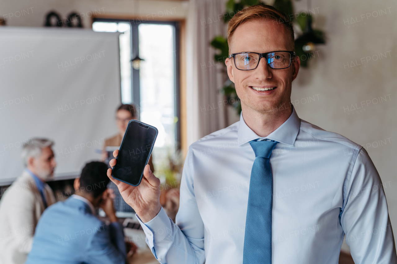 Portrait of young businessman during meeting in the office.