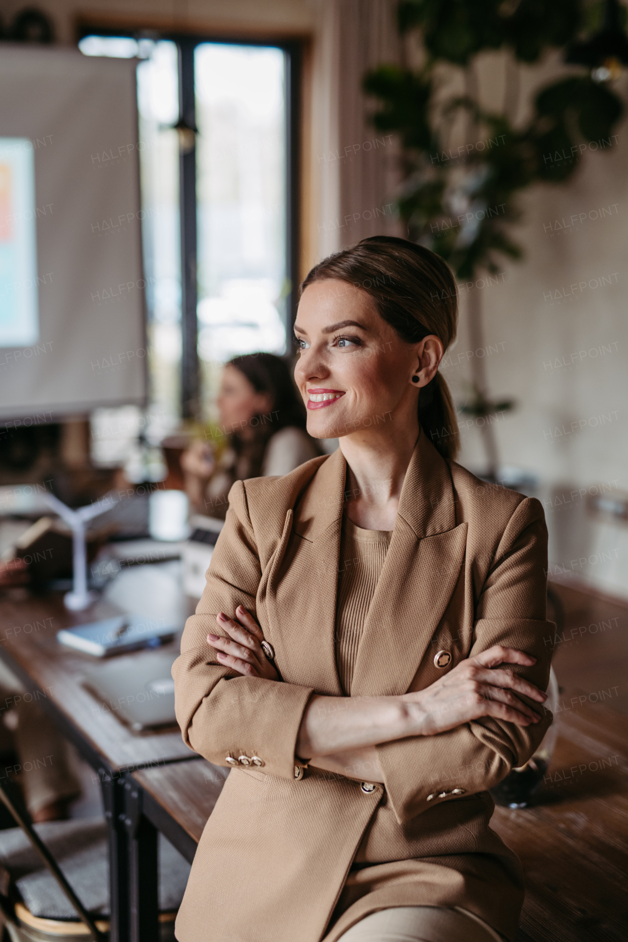 Portrait of young businesswoman during meeting in the office.