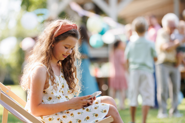 Portrait of beautiful birthday girl received birthday text message, text messaging back.