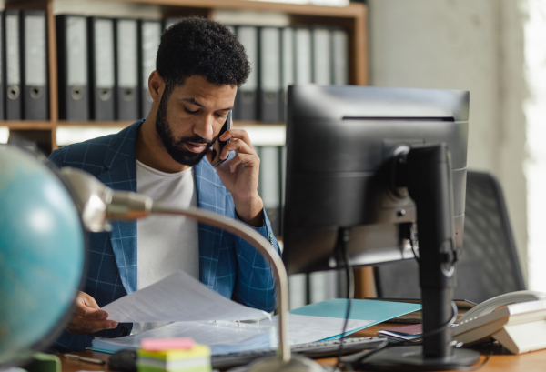 Young man sitting in an office and working.