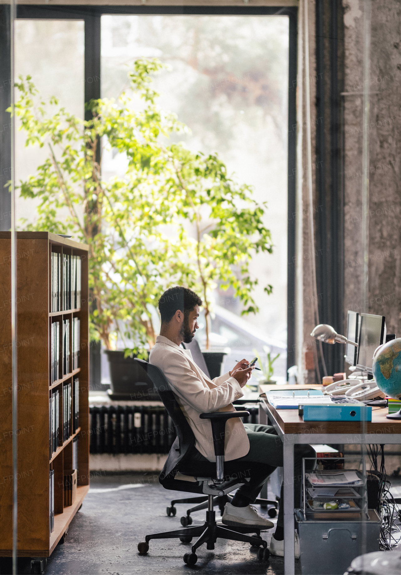 Young man sitting in an office and working.