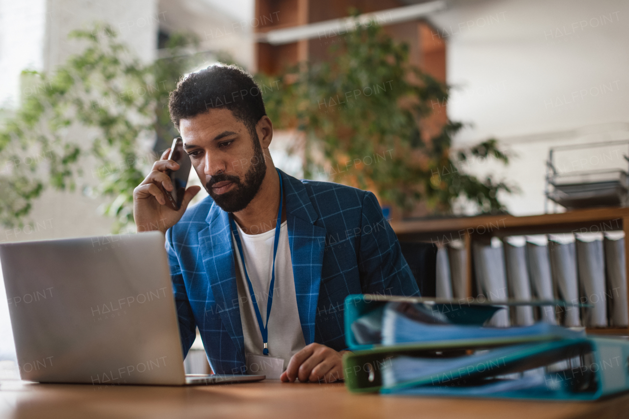 Young man sitting in an office and working.