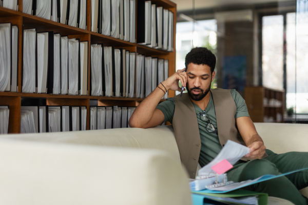 Young man sitting in an office and working.