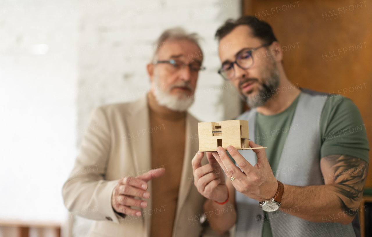 Young architects designing house for senior couple,