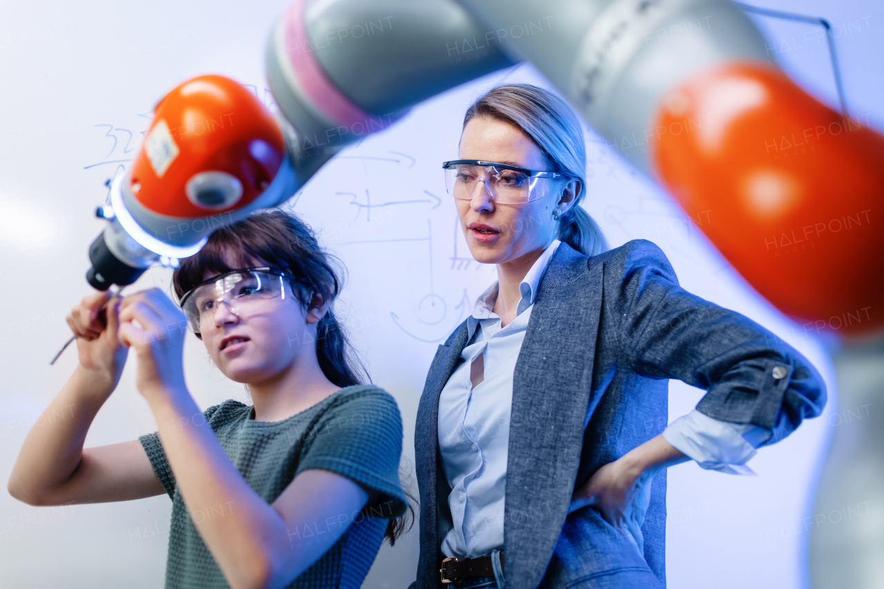 Mom and girl during take your daughter to work day, encouraging daughters in career in robotics.