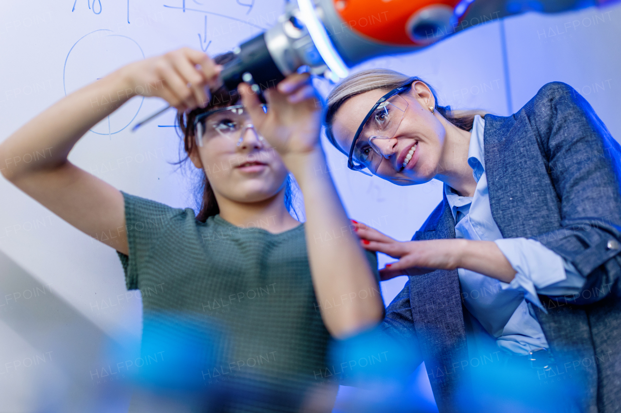 Mom and girl during take your daughter to work day, encouraging daughters in career in robotics.