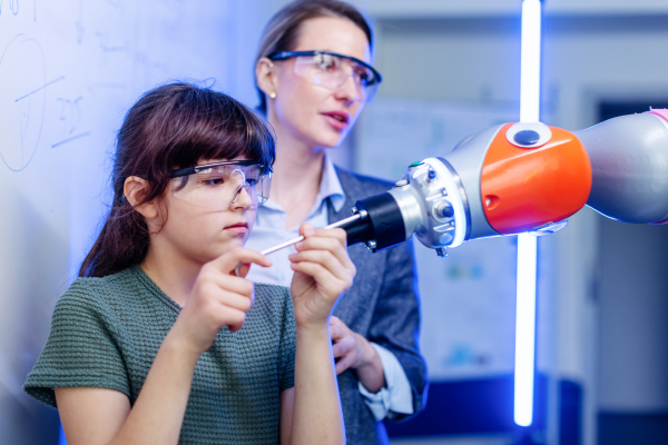 Mom and girl during take your daughter to work day, encouraging daughters in career in robotics.