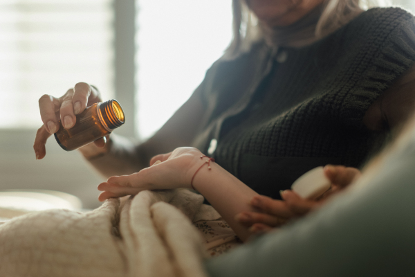 Close up of senior woman taking medicine.