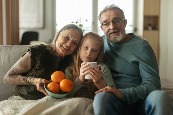 Grandparents taking care of little sick granddaughter.