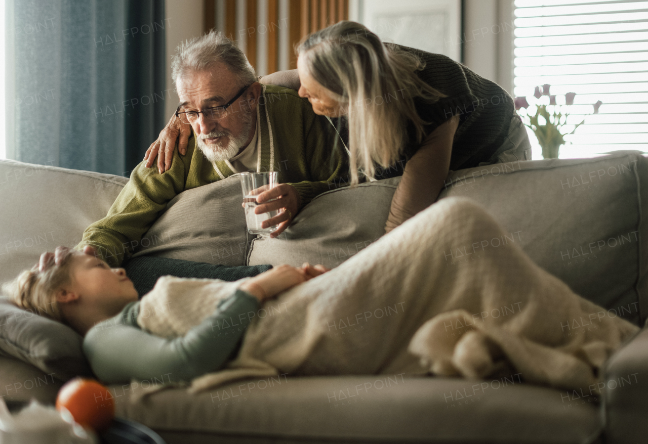 Grandparents taking care of little sick granddaughter.