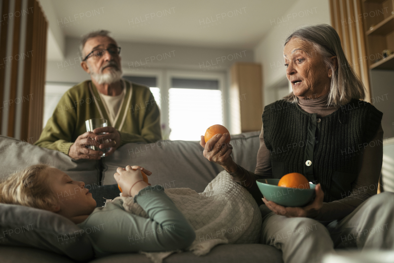 Grandparents taking care of little sick granddaughter.