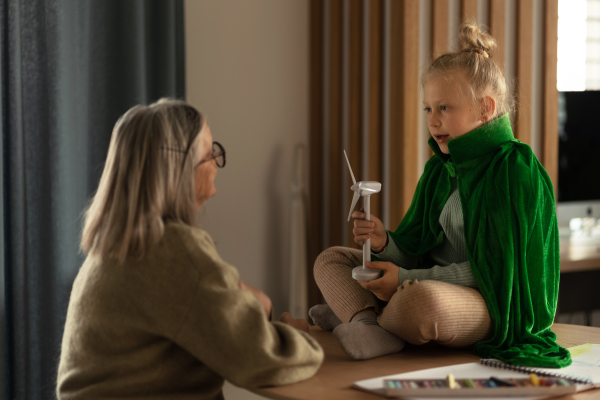 Senior woman studying with her granddaughter.