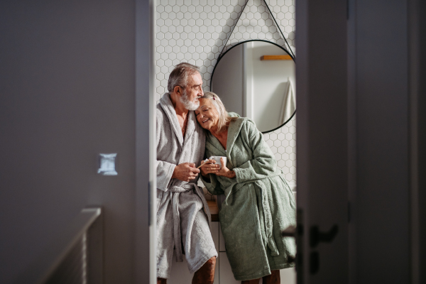 Senior couple having morning routine in the bathroom.