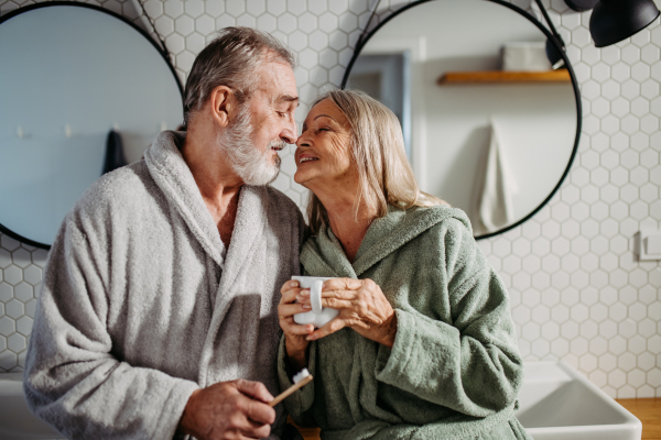 Senior couple having morning routine in the bathroom.