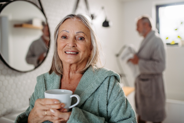 Senior couple having morning routine in the bathroom.