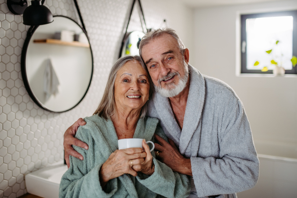 Senior couple having morning routine in the bathroom.