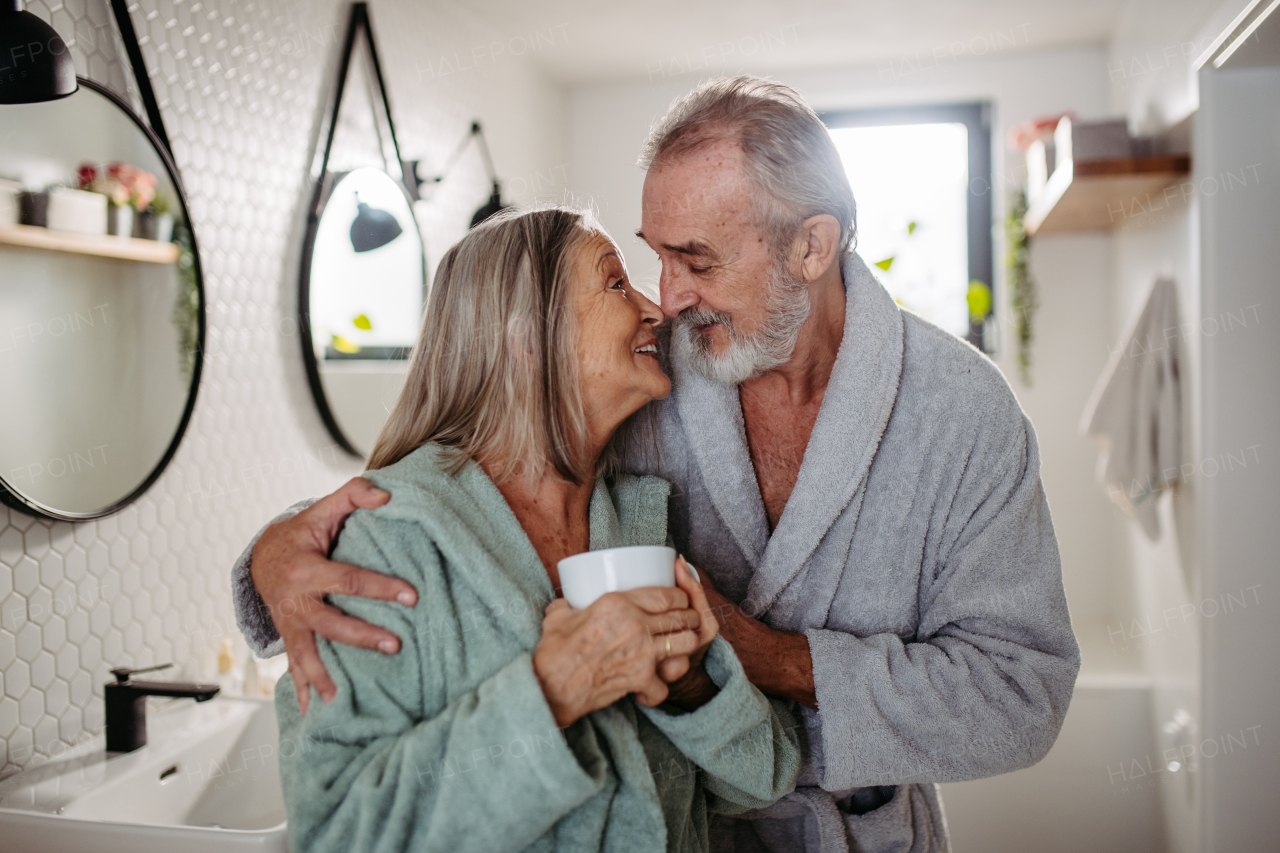 Senior couple having morning routine in the bathroom.