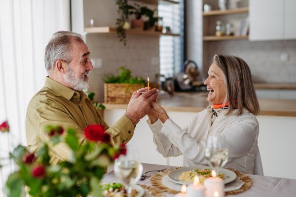 Senior man with his wife celebrating anniversary together.