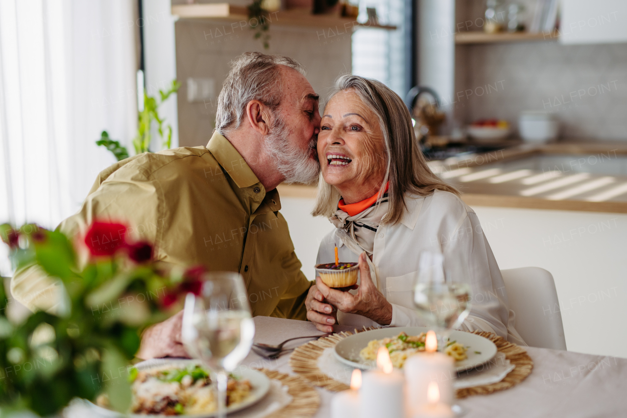 Senior man with his wife celebrating anniversary together.