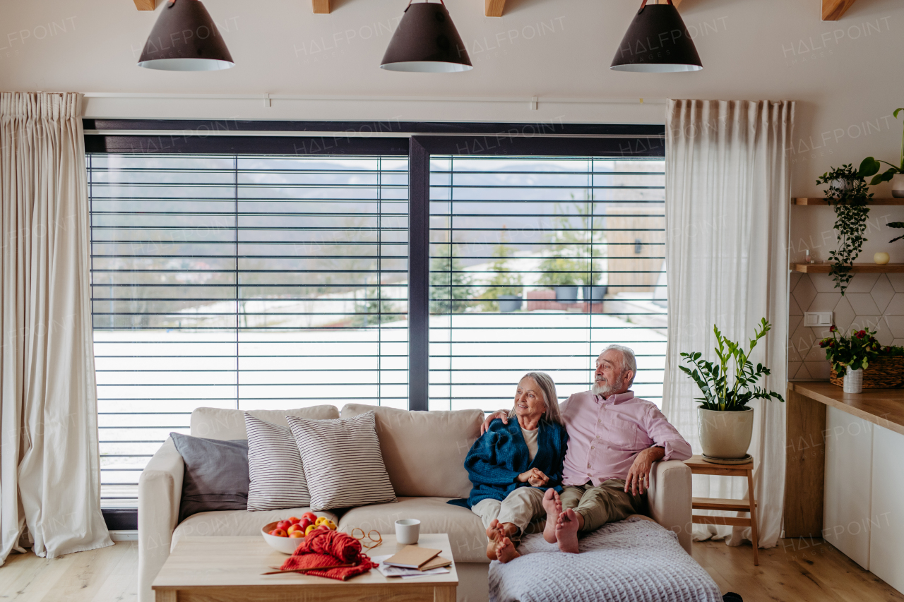 Senior couple enjoying time in their living room.