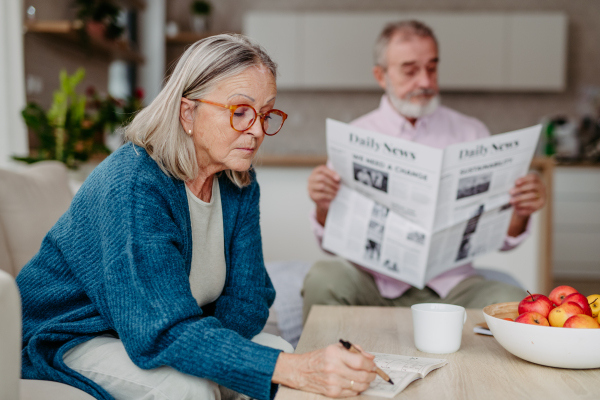 Senior couple spending leisure time together in the living room.