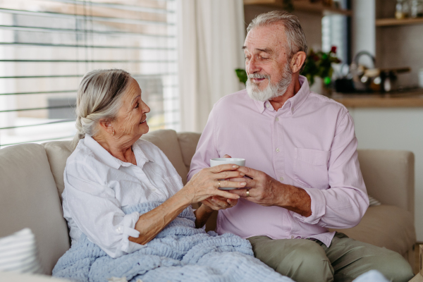 Senior couple enjoying time in their living room.