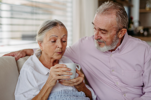 Senior couple enjoying time in their living room.