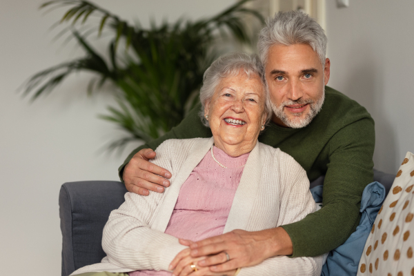 Portrait of mature man with his senior mother.