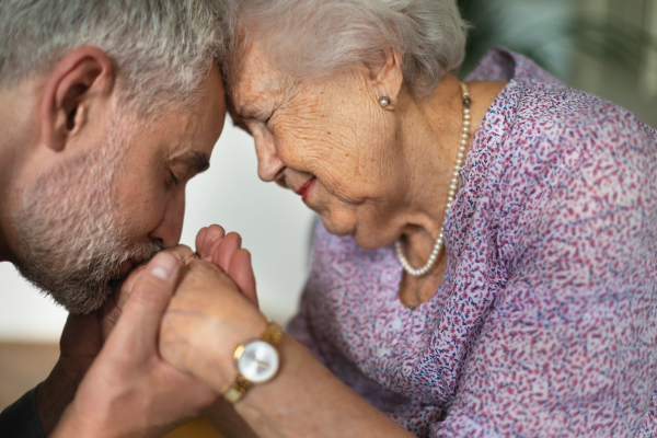 Portrait of mature man with his senior mother.