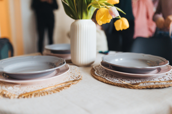 Close up of setting table for traditional easter lunch. Recreating family traditions and customs. Concept of family easter holidays.