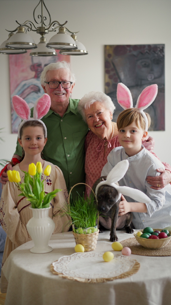 Easter video of grandparents with grandchildren before traditional easter lunch. Recreating family traditions and customs. Concept of family easter holidays.