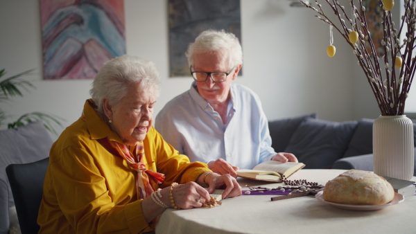 A video of a senior couple praying during an easter holidays. Concept of religious people.