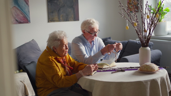 A video of a senior couple praying during an easter holidays. Concept of religious people.