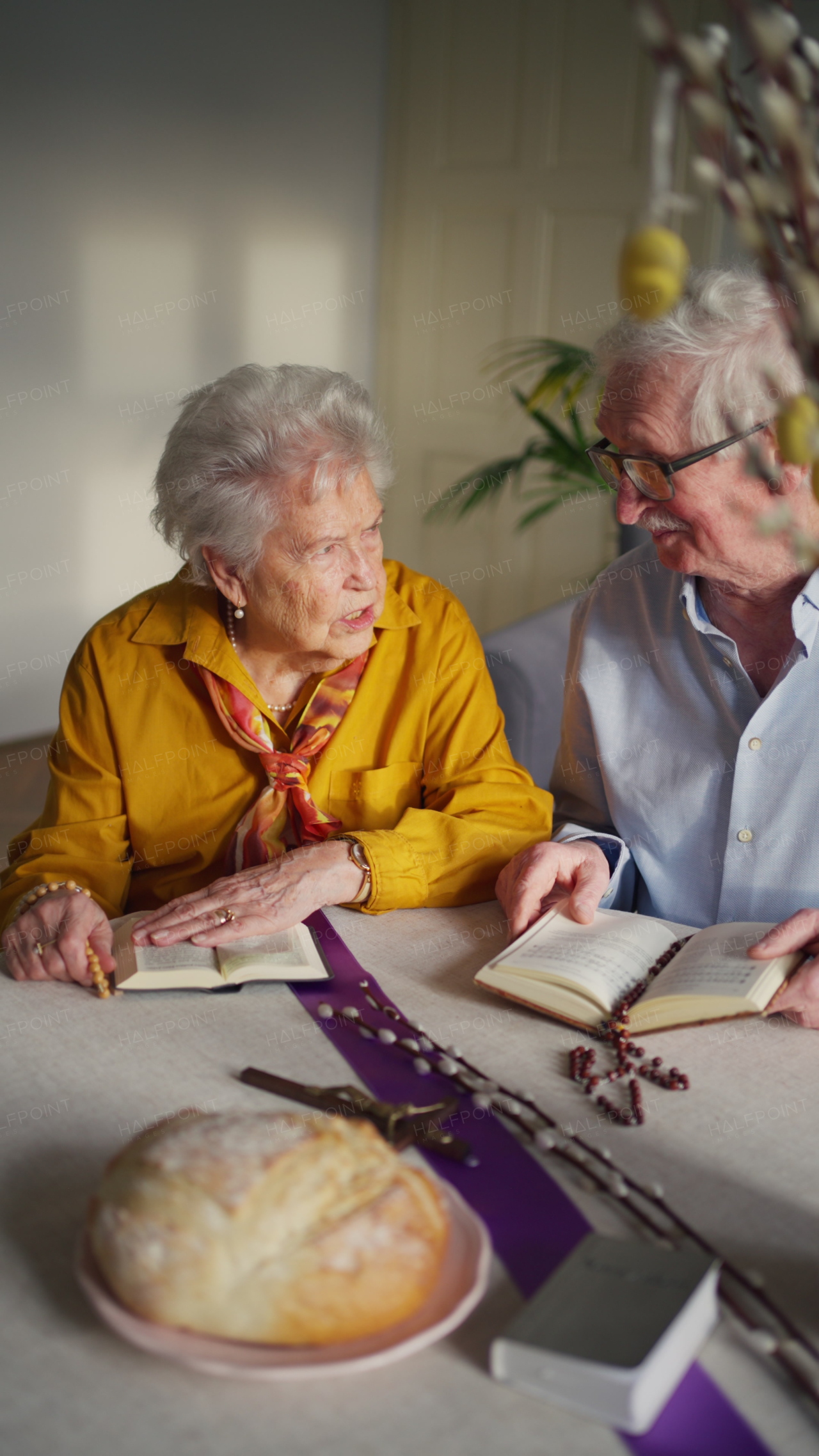 A video of a senior couple praying during an easter holidays. Concept of religious people.