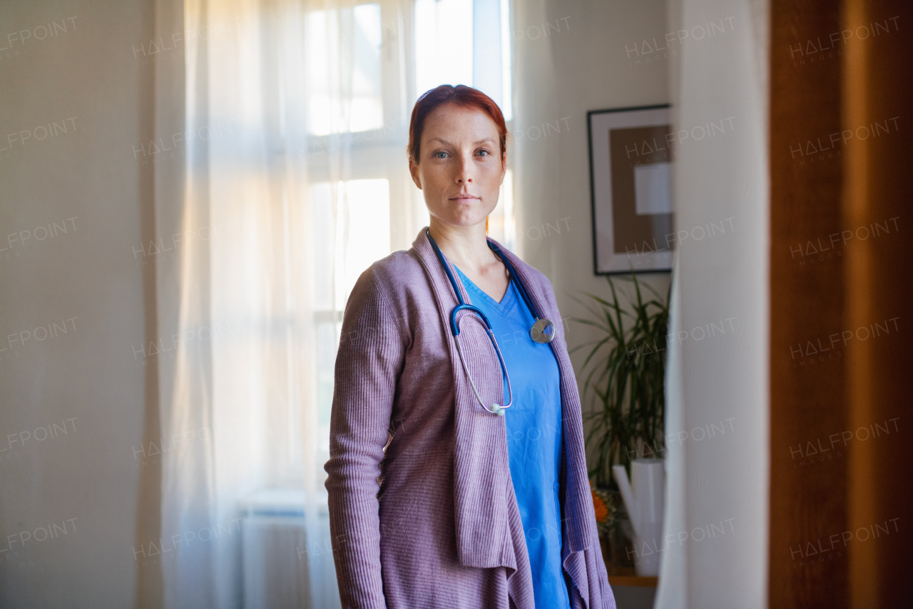 Portrait of young nurse, concept of healthcare in the seniors home.