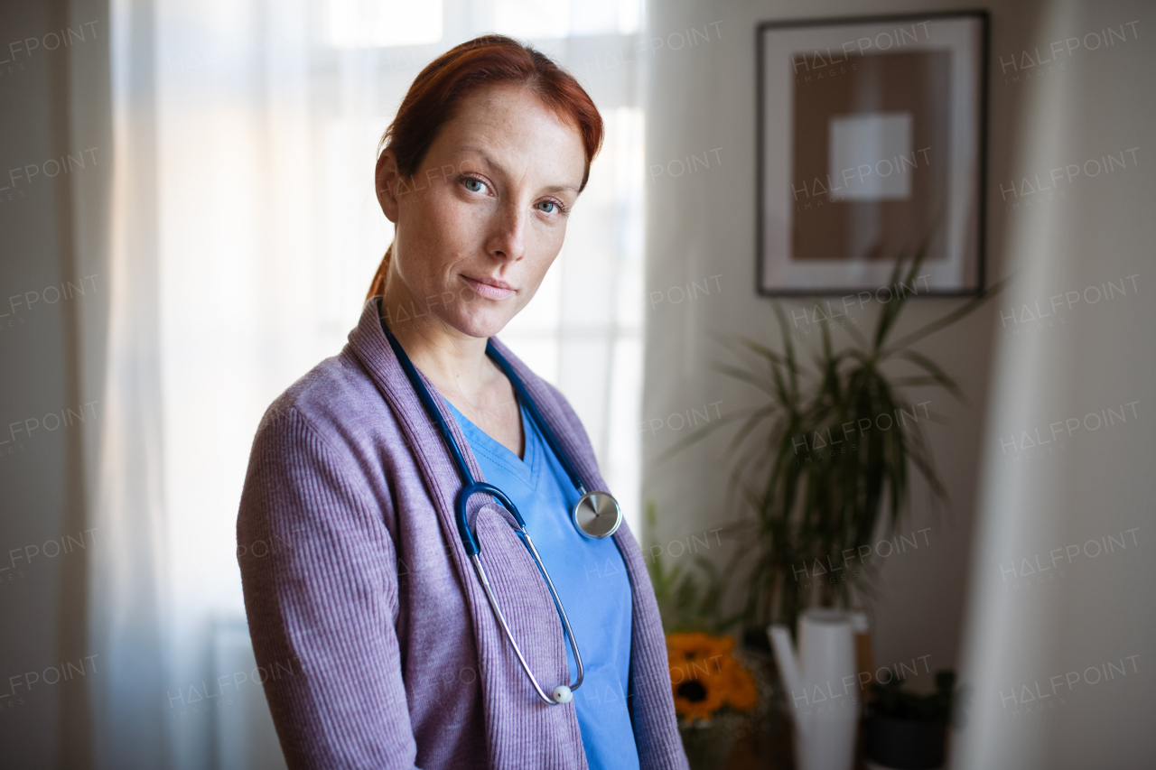 Portrait of young nurse, concept of healthcare in the seniors home.