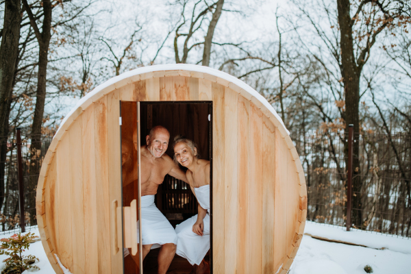 Senior couple enjoying together time in sauna, relax, spa and healthy lifestlye concept.