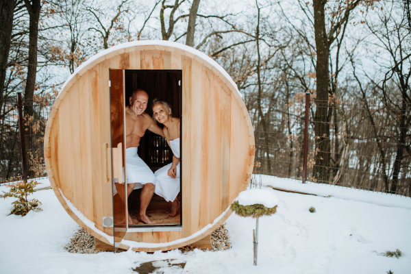 Senior couple enjoying together time in sauna, relax, spa and healthy lifestlye concept.