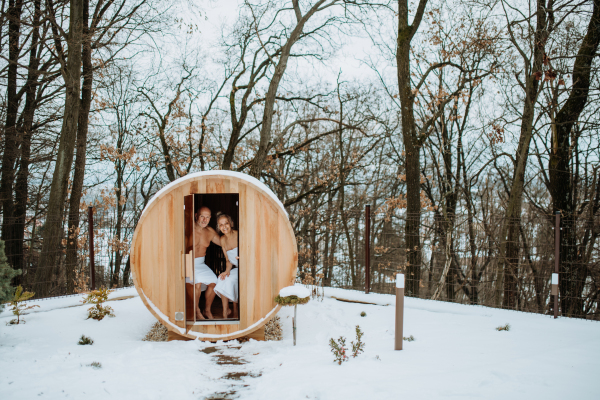 Senior couple enjoying together time in outdoor sauna, relax, spa and healthy lifestlye concept.