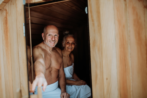 Senior couple enjoying together time in sauna, relax, spa and healthy lifestlye concept.