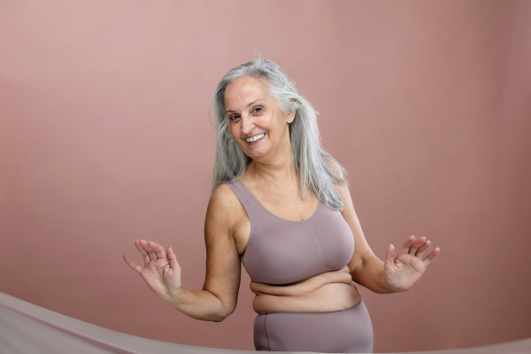 Portrait of senior woman in a lingerie, studio shoot.