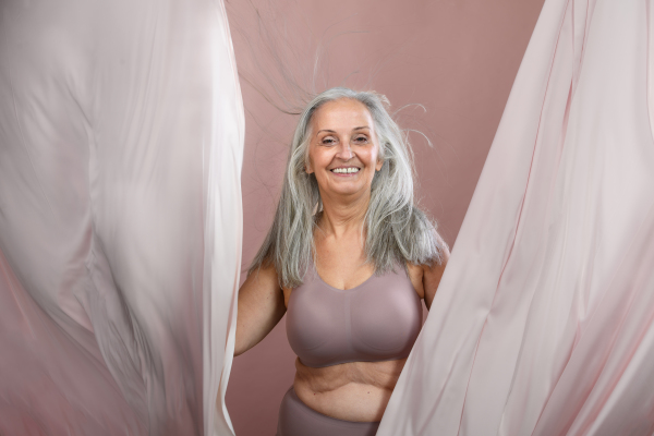 Portrait of happy senior woman in a studio.