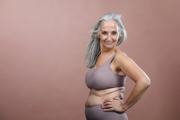 Portrait of senior woman in a lingerie, studio shoot.