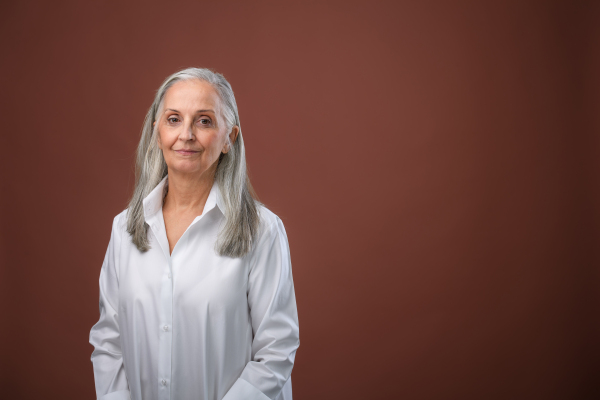 Portrait of elegant senior woman in a studio.